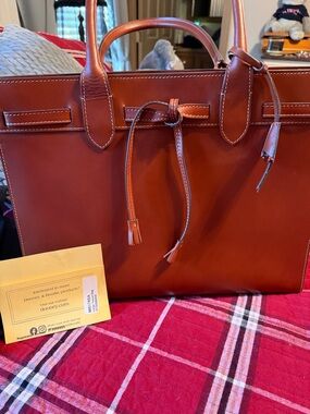 Dooney & Bourke Large tassel bag in saddle brown. Alto leather collection